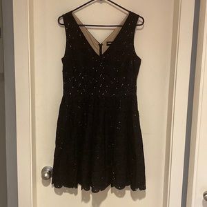 Karl Lagerfeld Navy with tan lined flower cutouts mid length party dress.